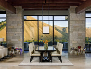 Timber Gulch dining room stone pillars glass wall
