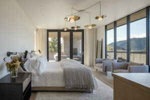 yellowstone club bedroom bright light fixture large windows