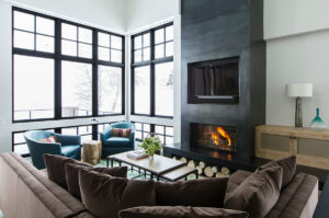 Elkhorn springs living room bright colors light sunny bright large windows fire place