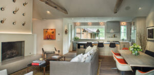 West Ketchum living room open space fireplace color pop wood beams
