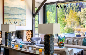 North of Ketchum Riverfront living room patio bright light glass sliding doors wood beams