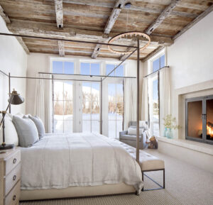 East fork bedroom french doors fire place wood beams light bright sunny