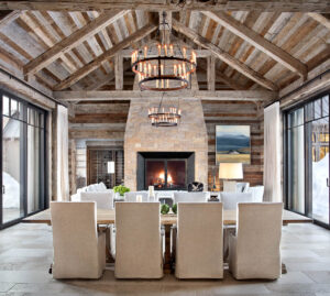 East fork dining room living room wood beams fire place floor to ceiling sliding glass doors