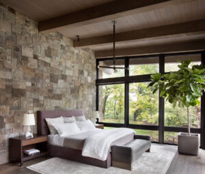 Lake Minnetonka bedroom wood beams stone wall glass walls